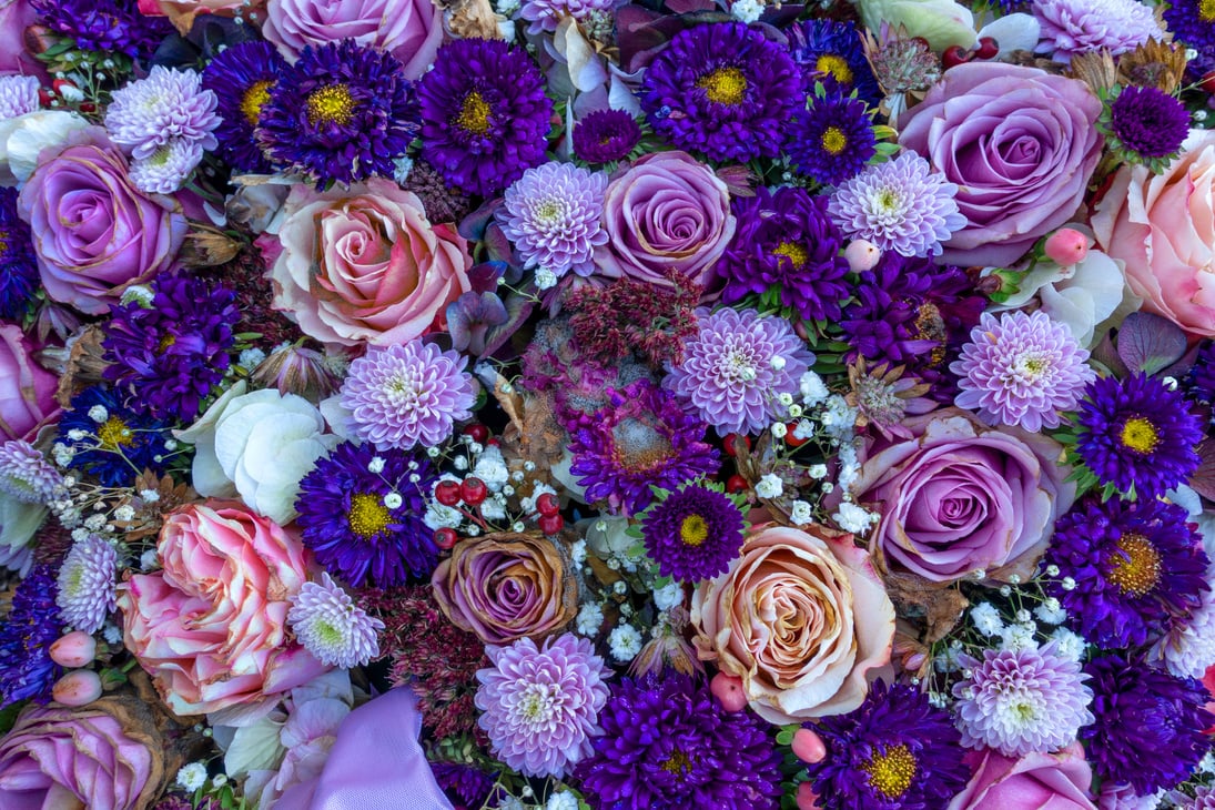 Slightly withered purple flower arrangement